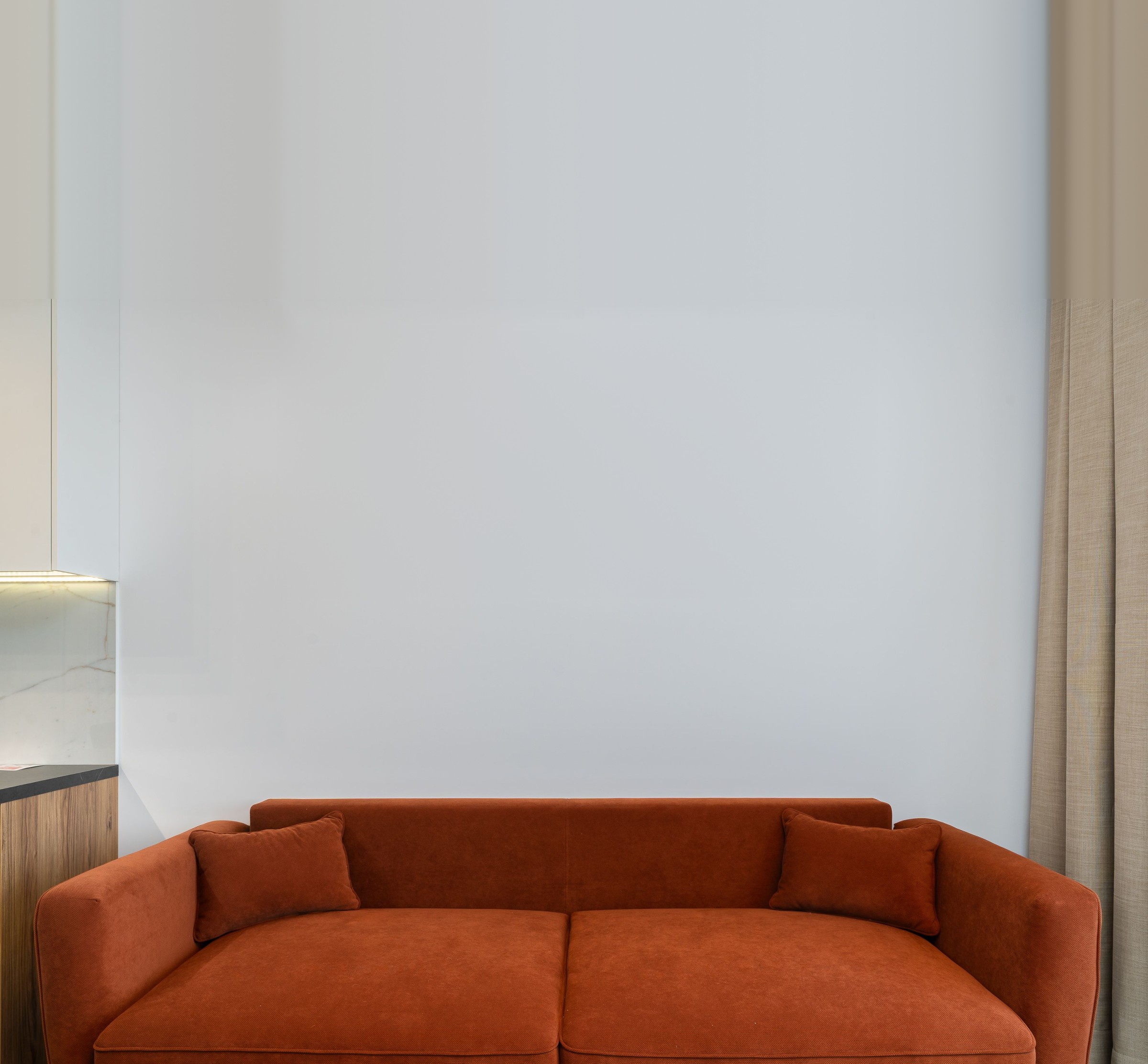 Living room wall above a sofa